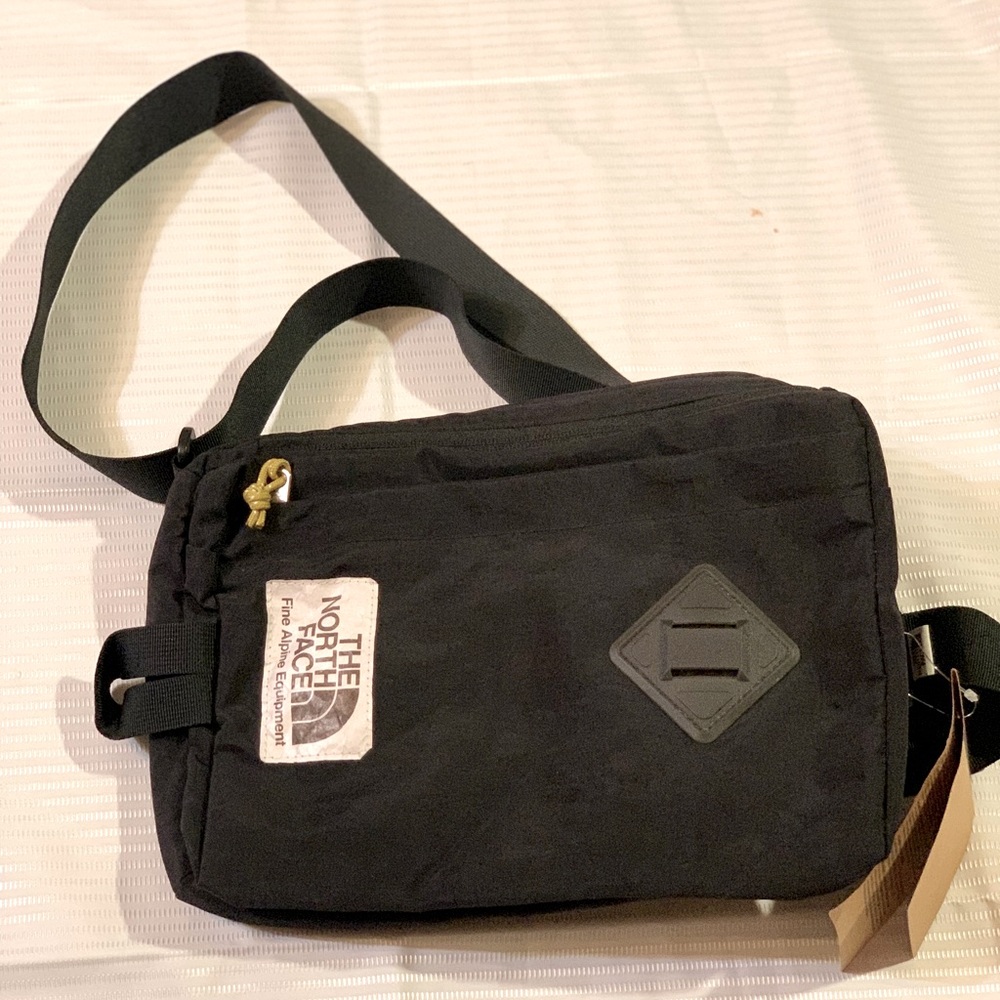The North Face Black Messenger Bag with Adjustable Strap. NWT